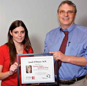 photo of student Sarah D'Amour being congratulated by professor Laurence Harris