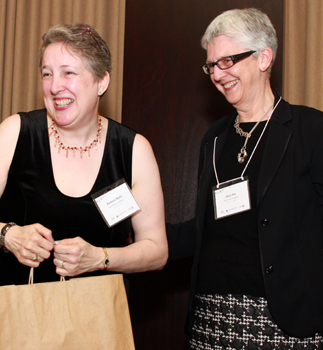 photo of Conference co-organizers Barb Wells, executive assistant to the associate vice-president Graduate at York University, with Alice Pitt, Vice-Provost Academic, share a lighter moment during the awards presentation ceremony