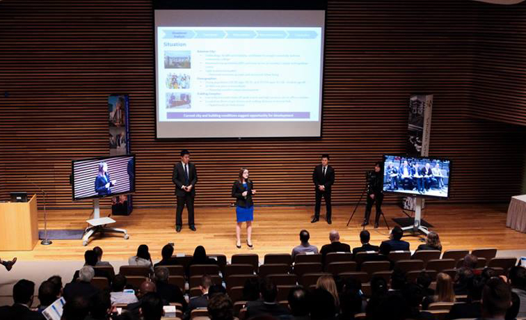 photo of a group of people making presentation on stage