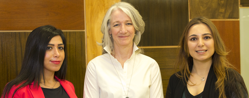 photo of Dean Barbara Crow with two postdoctoral fellows