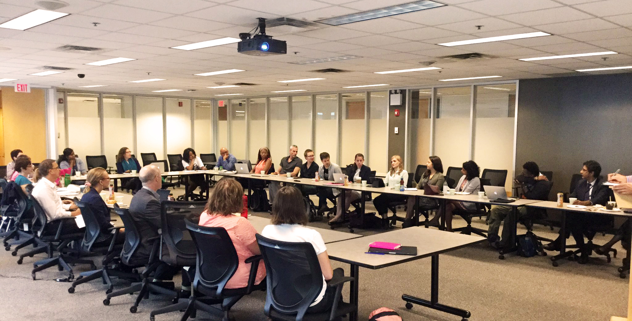 participants discuss the program while sitting around the table