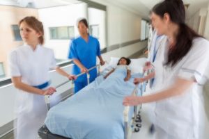 photo of hospital staff with a gurney