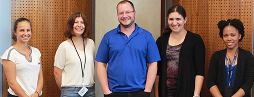 photo of professor Derek Wilson and his grad students