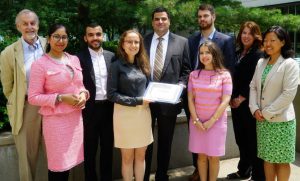 photo of a group of people in honour of an inaugural scholarship recipient