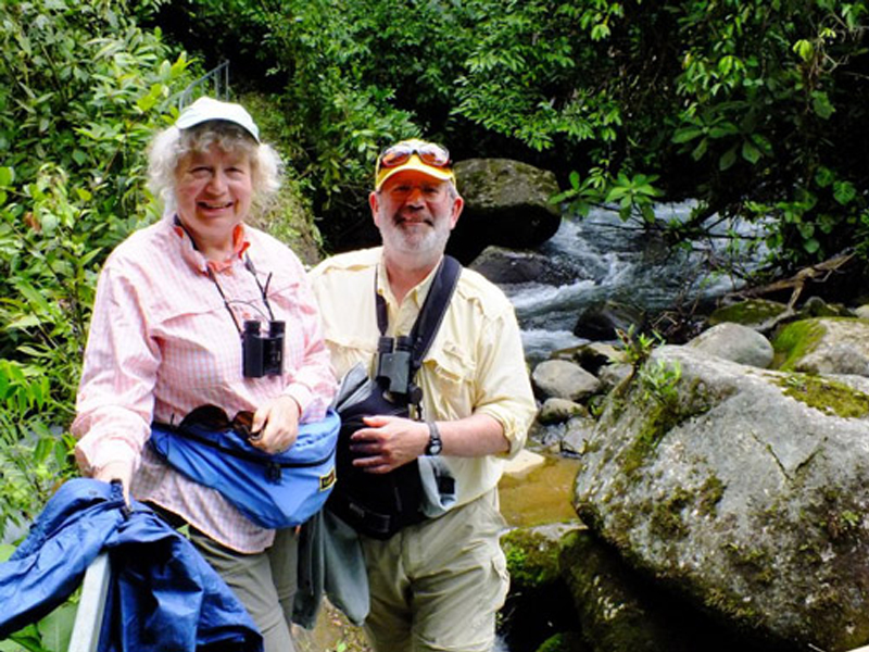 photo of Don Downer and Adrienne Perry at Penas Blancas River, the site of the old log bridge