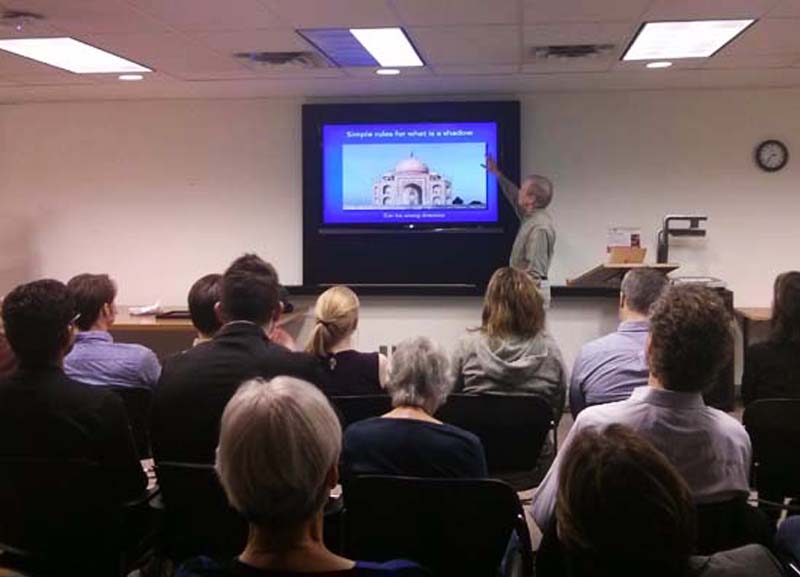 photo of Senior Research Fellow and VISTA Visiting Scholar Patrick Cavanagh gesturing to a slide during his lecture about the connection between art and neuroscience