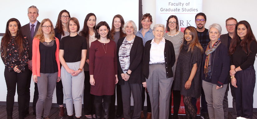 Group photo of Dean Thomas Loebel, judges and student participants from the 2019 3MT competition